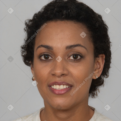 Joyful black young-adult female with short  brown hair and brown eyes