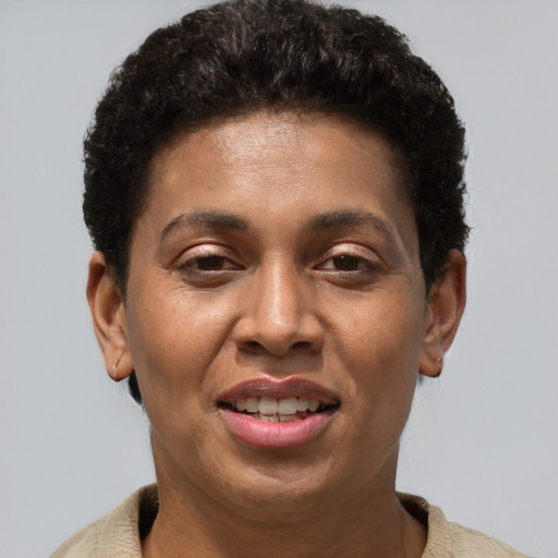 Joyful black adult female with short  brown hair and brown eyes