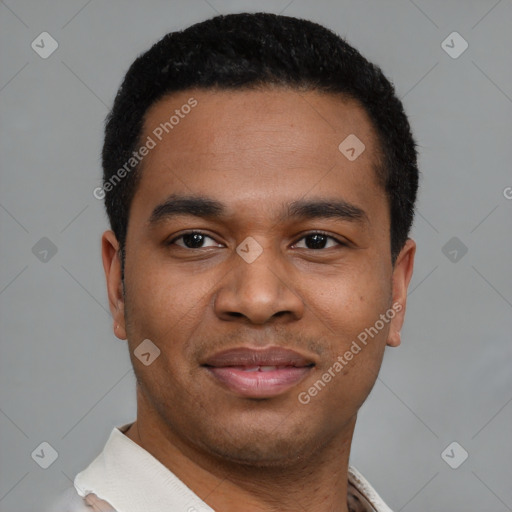 Joyful latino young-adult male with short  black hair and brown eyes