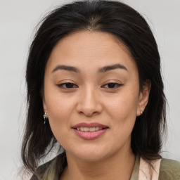 Joyful asian young-adult female with medium  brown hair and brown eyes