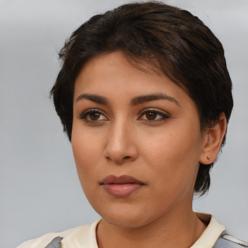 Neutral latino young-adult female with medium  brown hair and brown eyes