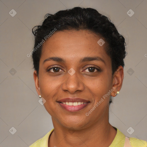 Joyful black young-adult female with short  brown hair and brown eyes