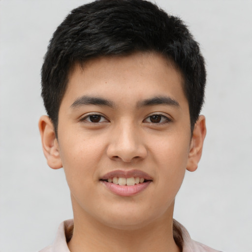 Joyful asian young-adult male with short  brown hair and brown eyes
