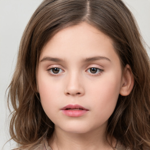 Neutral white child female with long  brown hair and brown eyes