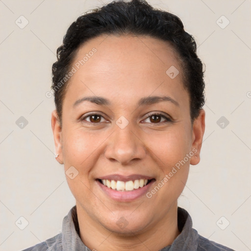 Joyful white young-adult female with short  black hair and brown eyes