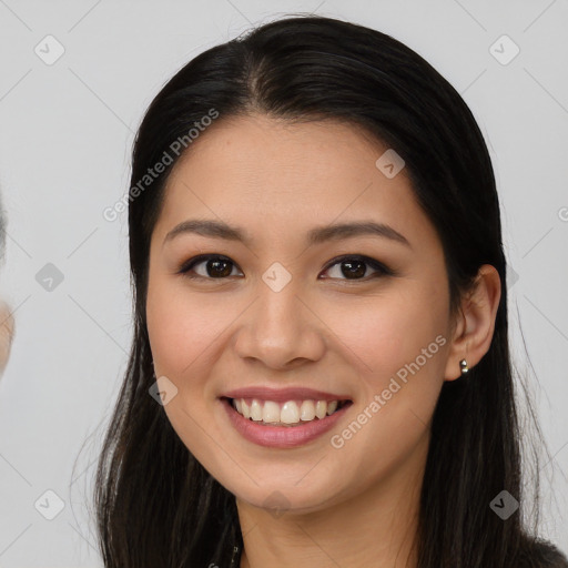 Joyful asian young-adult female with long  brown hair and brown eyes