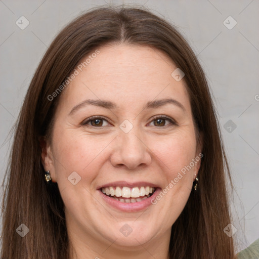 Joyful white adult female with long  brown hair and brown eyes