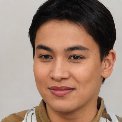 Joyful asian young-adult female with short  brown hair and brown eyes
