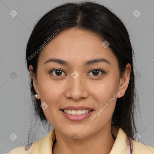 Joyful latino young-adult female with medium  brown hair and brown eyes