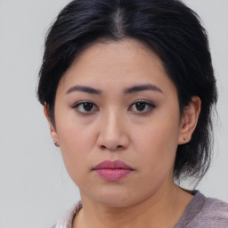 Neutral asian young-adult female with medium  brown hair and brown eyes