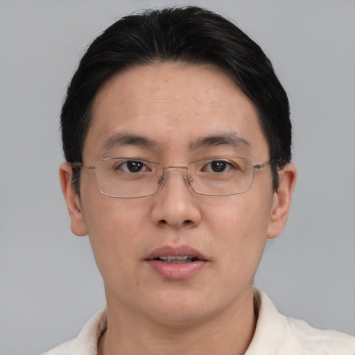 Neutral asian adult male with short  black hair and brown eyes