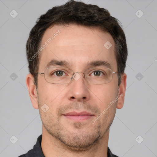 Joyful white adult male with short  brown hair and brown eyes