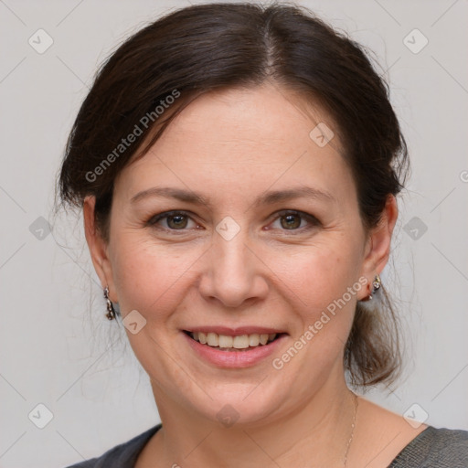 Joyful white adult female with medium  brown hair and grey eyes