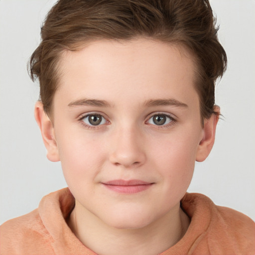 Joyful white child female with short  brown hair and grey eyes