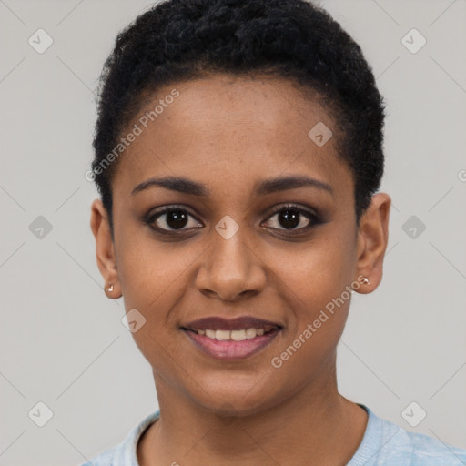 Joyful black young-adult female with short  black hair and brown eyes