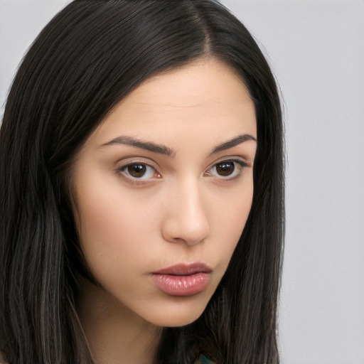 Neutral white young-adult female with long  brown hair and brown eyes