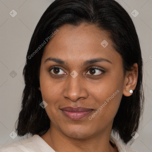 Joyful latino young-adult female with medium  brown hair and brown eyes