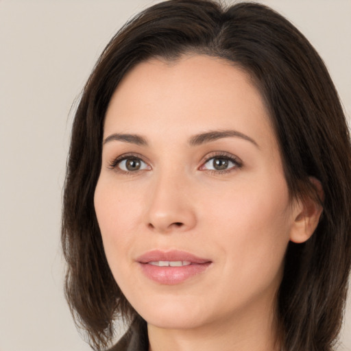 Joyful white young-adult female with medium  brown hair and brown eyes