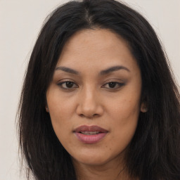 Joyful asian young-adult female with long  brown hair and brown eyes