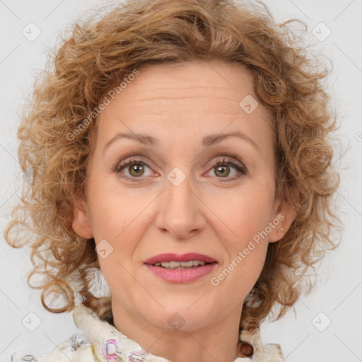 Joyful white adult female with medium  brown hair and blue eyes