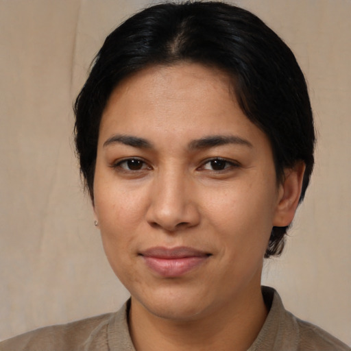 Joyful asian young-adult female with short  black hair and brown eyes