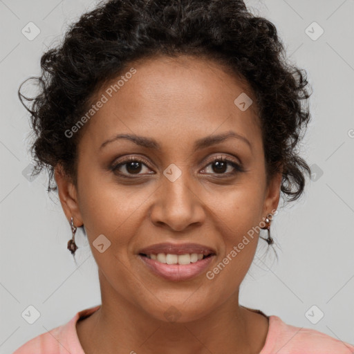 Joyful black adult female with short  brown hair and brown eyes