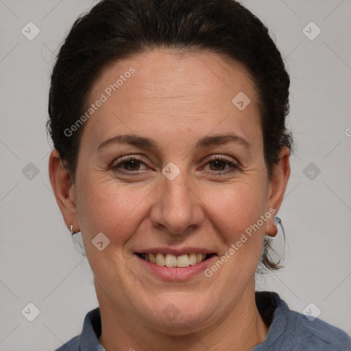 Joyful white adult female with short  brown hair and brown eyes