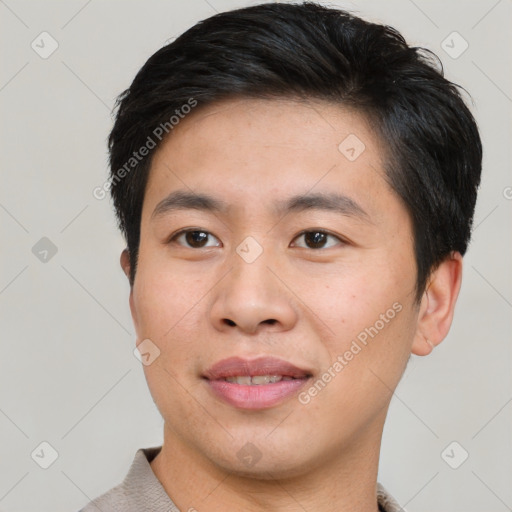 Joyful asian young-adult male with short  brown hair and brown eyes