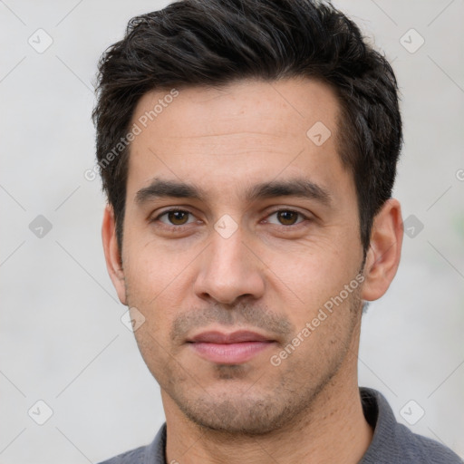 Neutral white young-adult male with short  black hair and brown eyes
