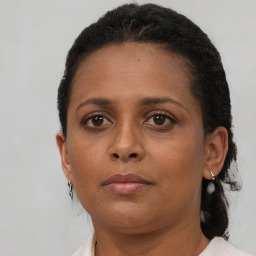 Neutral black young-adult female with short  brown hair and brown eyes