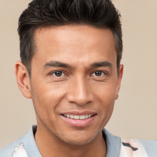 Joyful white adult male with short  brown hair and brown eyes