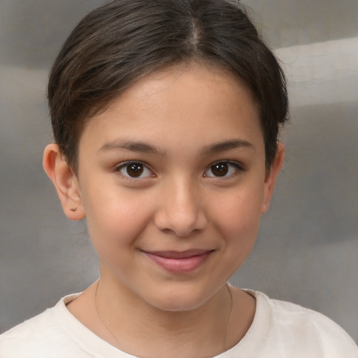 Joyful white child female with short  brown hair and brown eyes