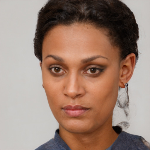 Neutral black young-adult female with short  brown hair and brown eyes