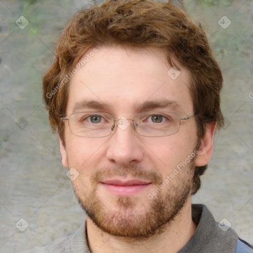 Joyful white adult male with short  brown hair and grey eyes