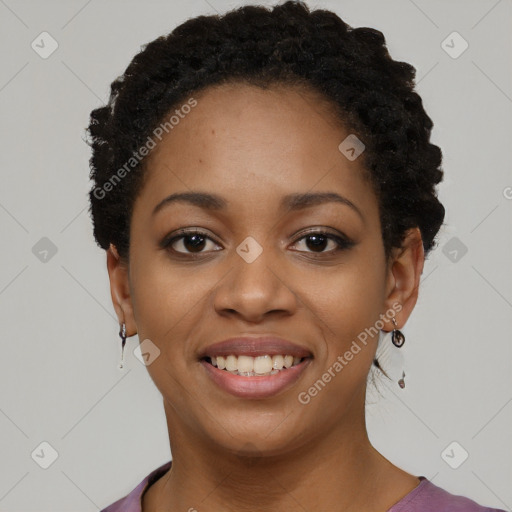 Joyful black young-adult female with short  black hair and brown eyes