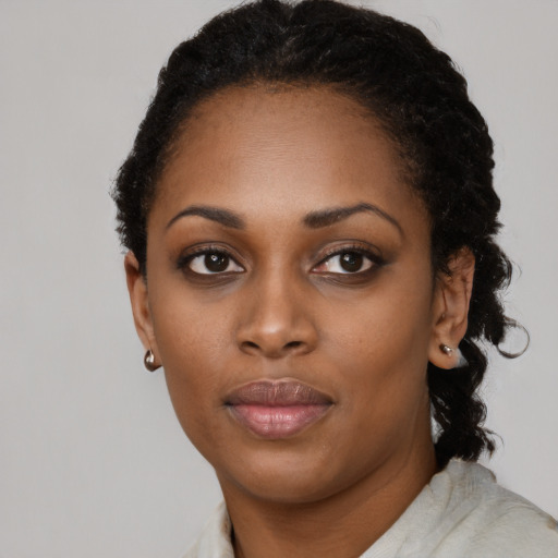 Neutral black young-adult female with short  black hair and brown eyes