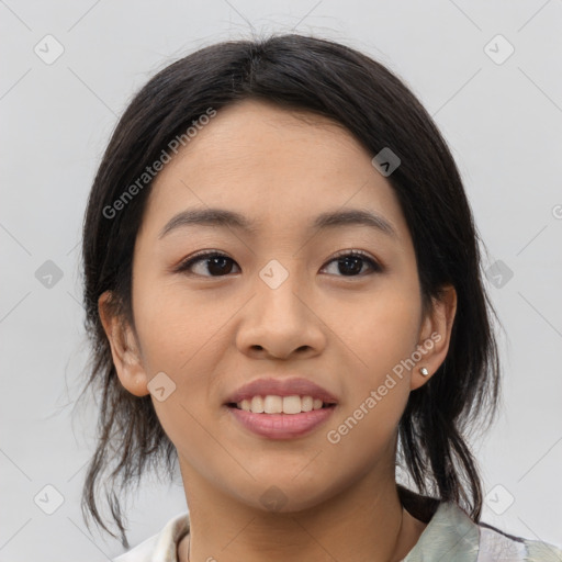 Joyful asian young-adult female with medium  black hair and brown eyes