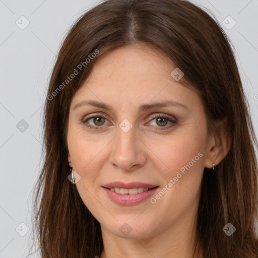 Joyful white adult female with long  brown hair and brown eyes