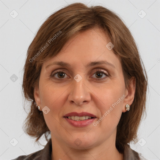 Joyful white adult female with medium  brown hair and grey eyes