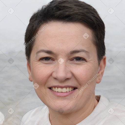 Joyful white adult female with short  brown hair and brown eyes