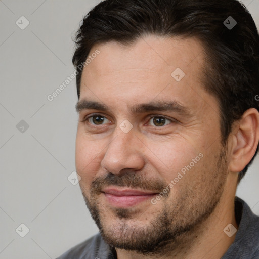 Joyful white adult male with short  brown hair and brown eyes