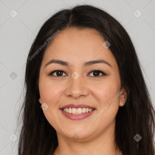 Joyful latino young-adult female with long  brown hair and brown eyes