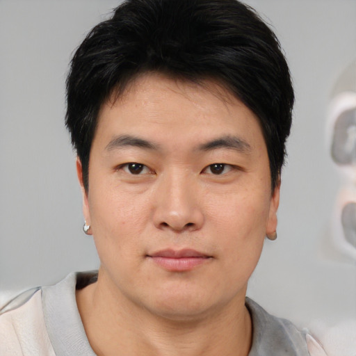 Neutral asian young-adult male with short  black hair and brown eyes