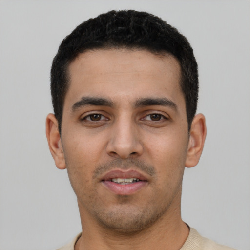 Neutral latino young-adult male with short  black hair and brown eyes