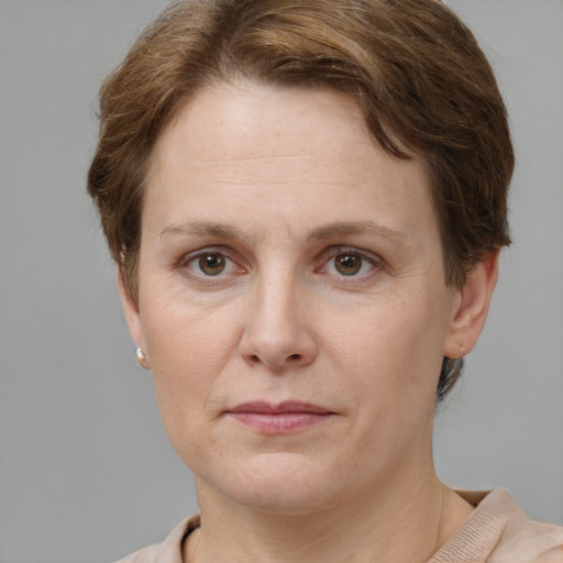 Joyful white adult female with short  brown hair and brown eyes