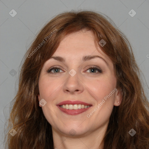 Joyful white adult female with long  brown hair and brown eyes