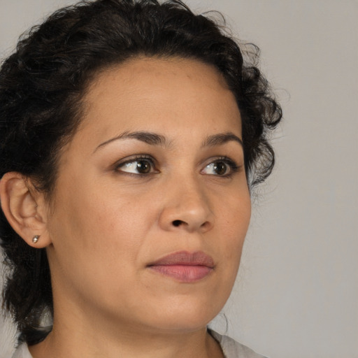 Neutral latino young-adult female with medium  brown hair and brown eyes