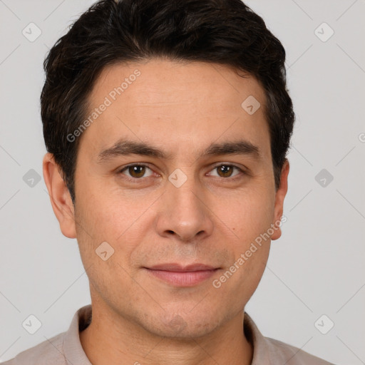 Joyful white adult male with short  brown hair and brown eyes