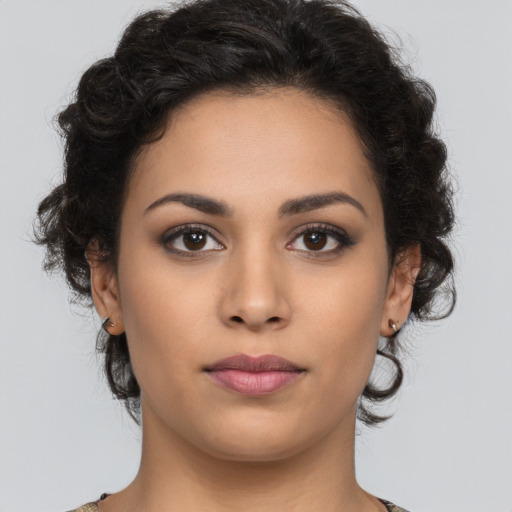Neutral latino young-adult female with long  brown hair and brown eyes
