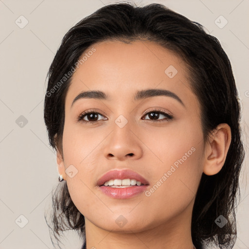 Joyful latino young-adult female with medium  black hair and brown eyes